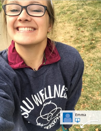 Social media post: Employee at college campus wearing promotional sweatshirt