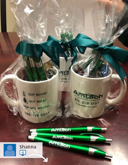 #SwaggingRights image of three promotional mugs and promotional pens sitting on a table for Amtech