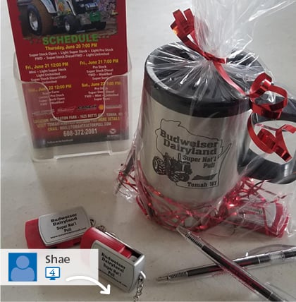 #SwaggingRights photo from Budweiser Dairyland showing a branded promo mug, pens and USB drives