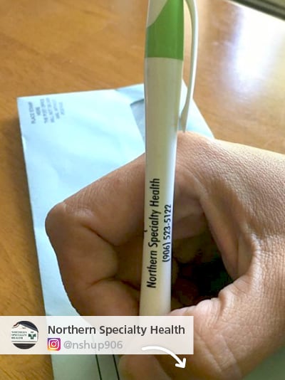 Northern Specialty Health photo from Instagram showing off a person writing with their promo pen