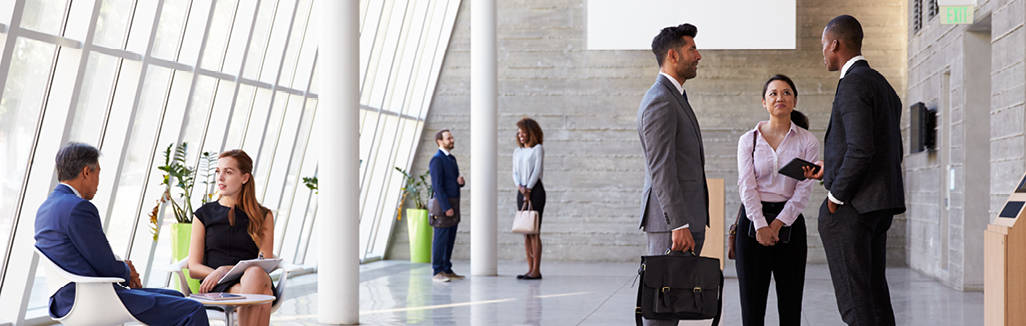 People mingling at a trade show.