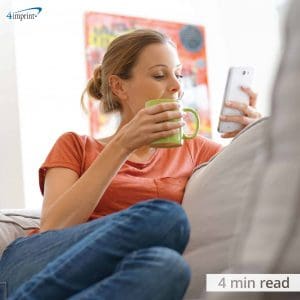 woman sitting on couch at home with phone looking and using cool tech giveaways for the house