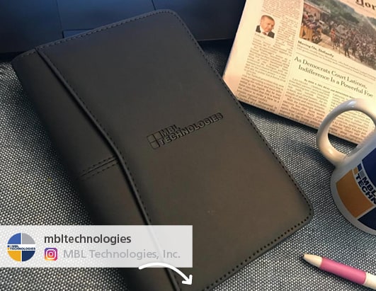 A social media post showing a branded padfolio.