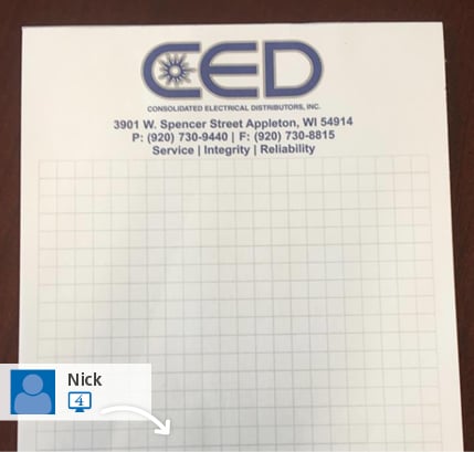 A social media post showing a branded notepad. 