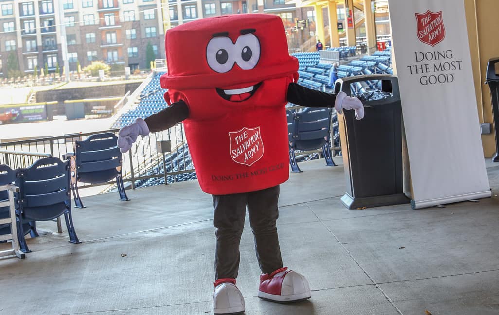 The salvation army red kettle mascot at a Home Run Derby Kettle Kick Off event
