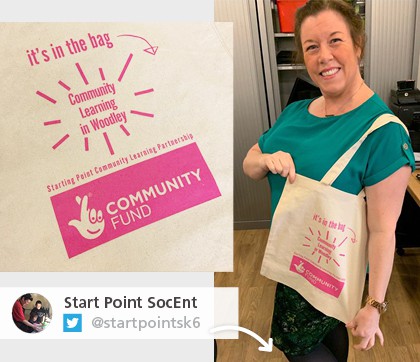 Twitter picture of a woman holding a promotional bag