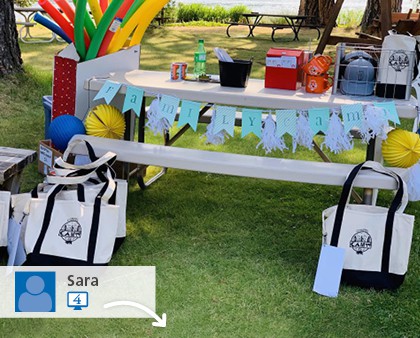 A social media picture of several promotional bags at an outdoor event