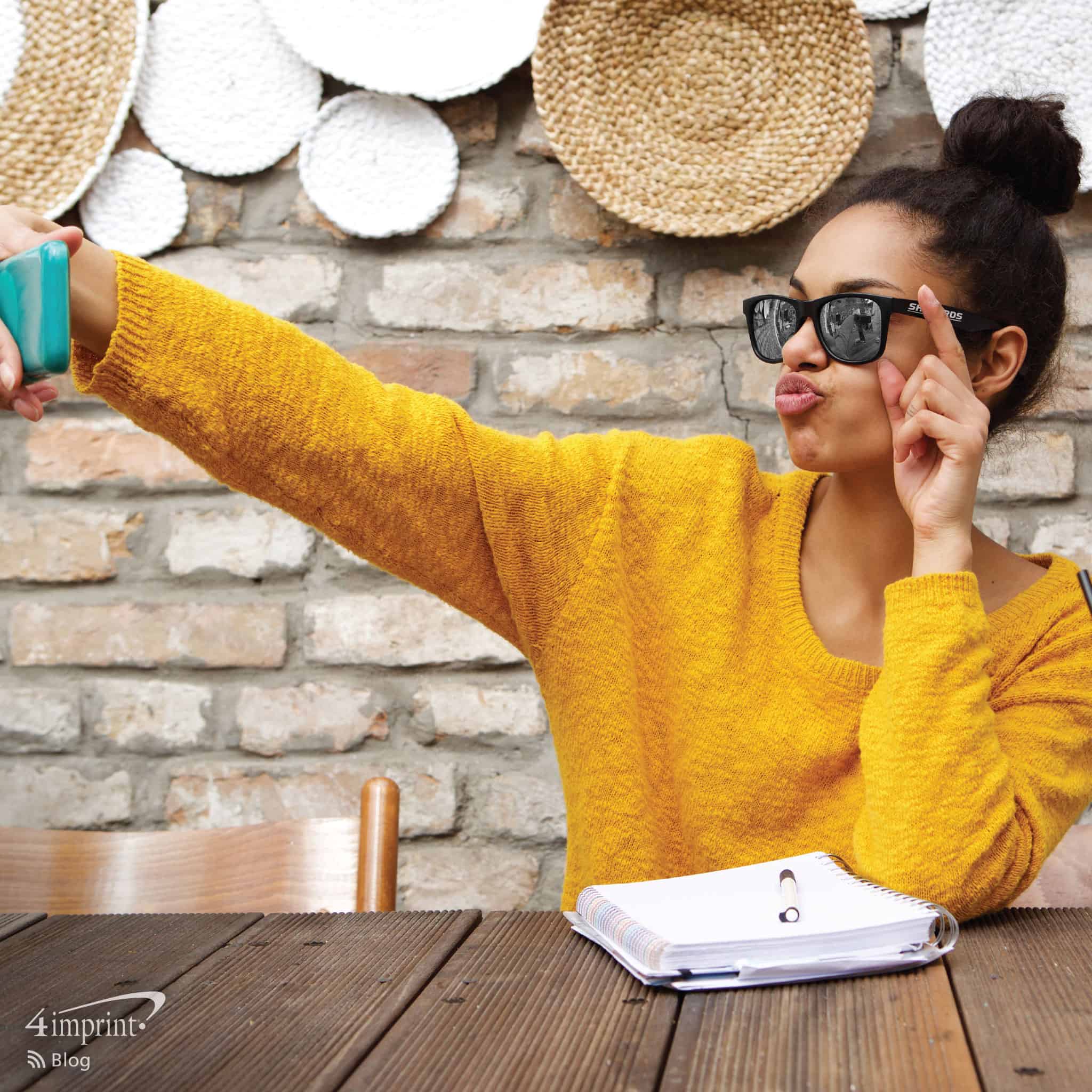 Photo of woman taking a selfie wearing bluetooth sunglasses. Bluetooth® Tech Giveaways Pair with Your Brand
