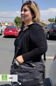 Picture of a woman carrying a promotional bag.