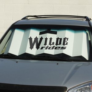 Accordion-style, branded car shade in windshield 